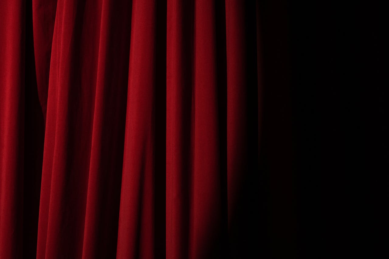 Spotlight on a Red Curtain